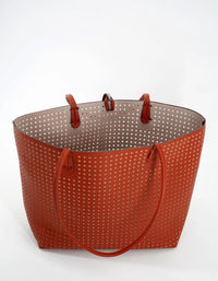 REMI/REID DEPARTURE PERFORATED SQUARE REVERSIBLE TOTE BAG - BURNT ORANGE/STONE