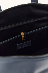 Button Down SF navy tumbled leather holdall bag with shark fin detail and shoulder strap. 100% real leather.