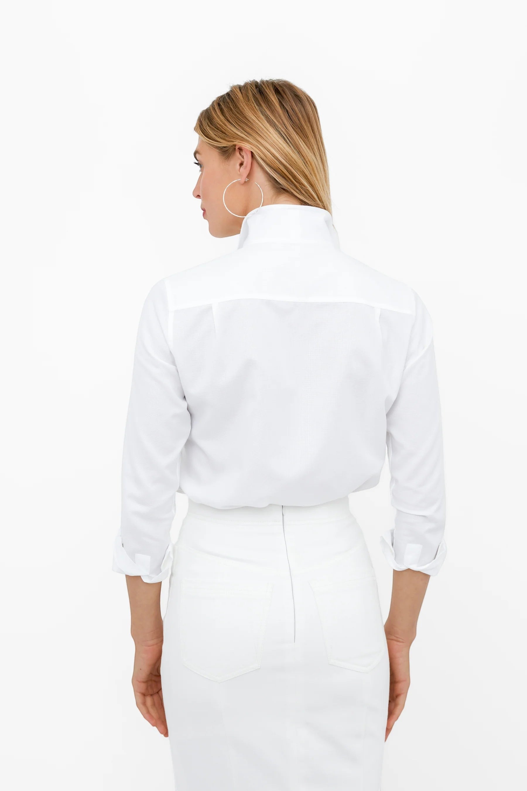 Button Down SF white cotton pique shirt with flared collar, concealed placket, and chamfer cuffs.