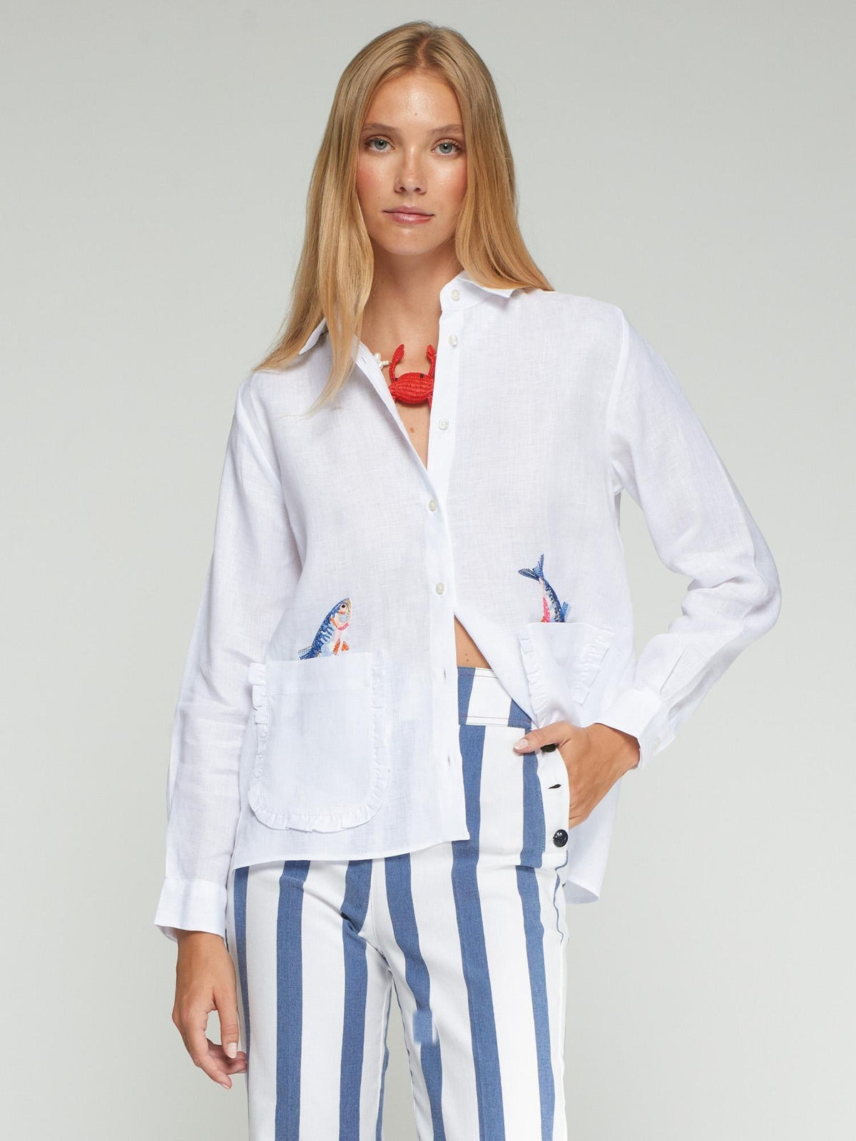 Button Down SF white 100% linen shirt with embroidered fish on pockets and ruffled trim.