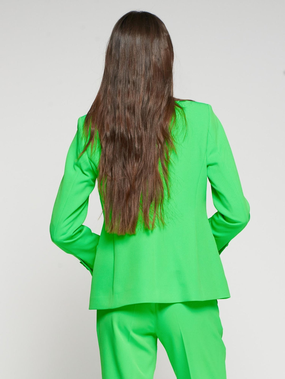 Button Down SF bright green neon polyester-elastane jacket with lapel, button closure, and two patch pockets.