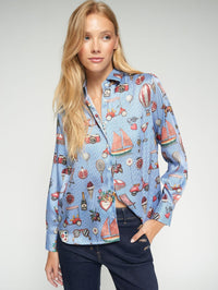 Button Down SF blue polyester shirt with vintage print of sailboats, scooters, ice cream, and cameras. Straight cut with classic collar.