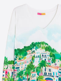 Button Down SF white V-neck sweater with a colourful print of a Mediterranean village and palm trees. 90% cotton, 10% nylon.