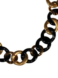 Button Down SF chunky chain link necklace with black resin and brushed gold-tone links.