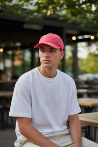 Button Down SF coral polyester baseball cap with shark fin logo detail.