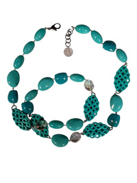 Button Down SF turquoise resin statement necklace with intricate carved details and polished beads. Made in Paris.