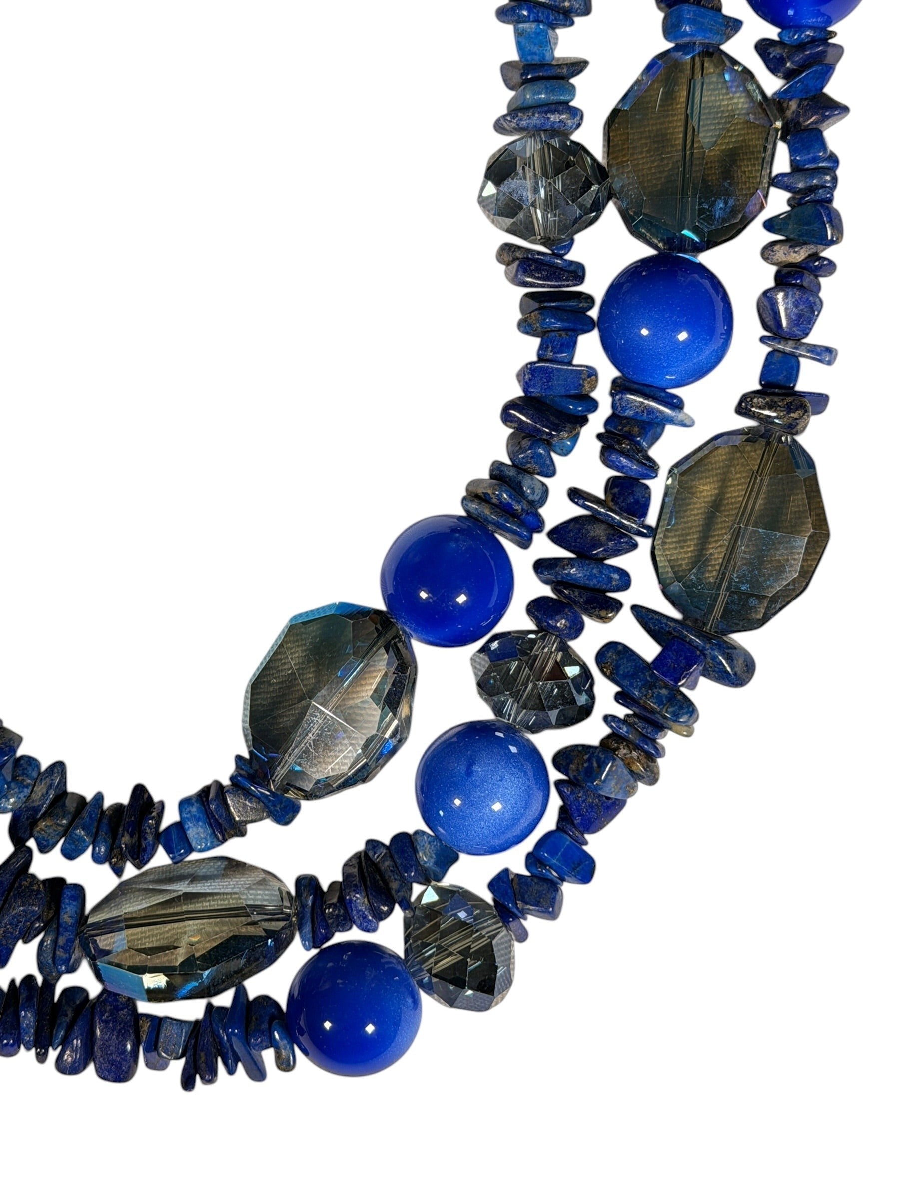 Button Down SF three-strand blue chip and crystal beaded necklace. Adjustable length.