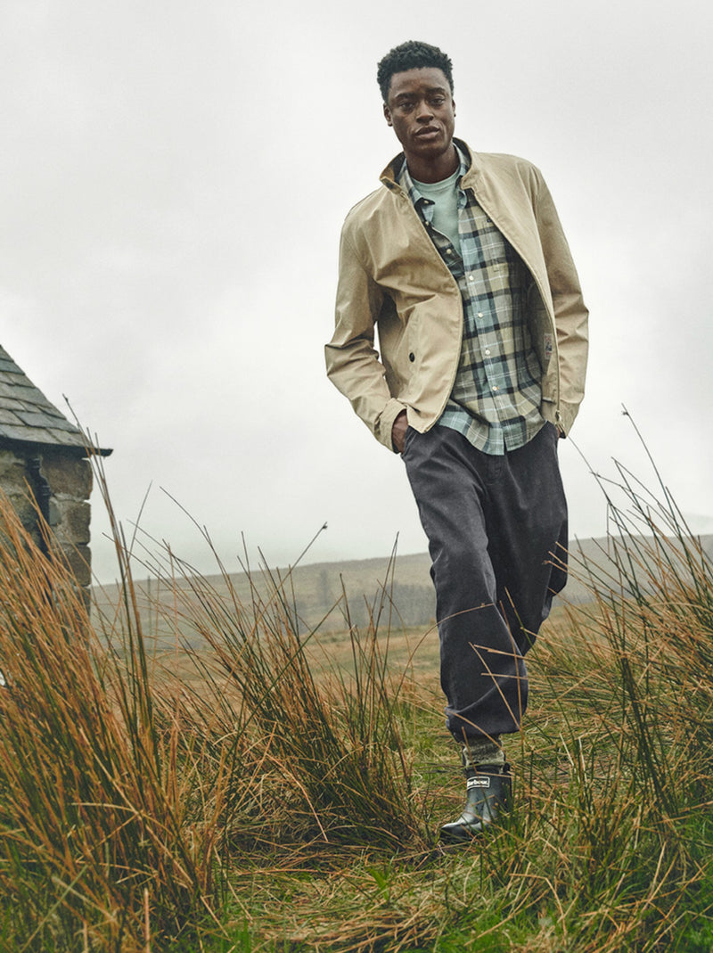 Button Down SF man wearing a light beige jacket over a blue and green tartan 100% cotton short-sleeved shirt.