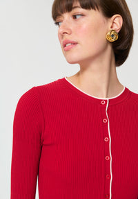 Button Down SF cerise ribbed knit cardigan with white trim and button front. Viscose/polyamide blend.