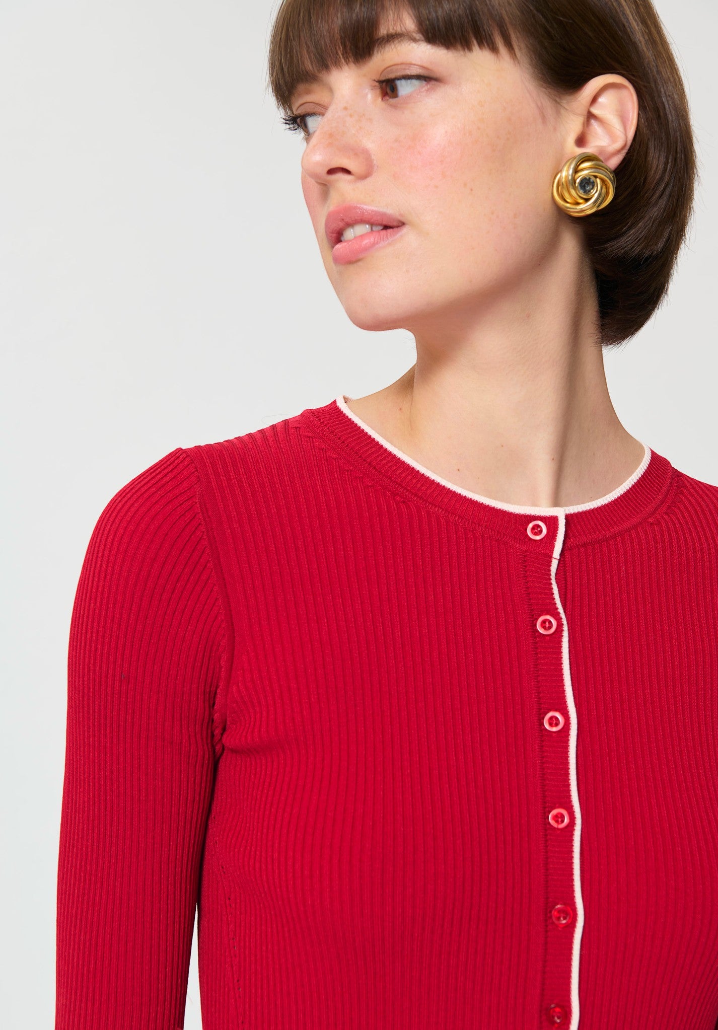 Button Down SF cerise ribbed knit cardigan with white trim and button front. Viscose/polyamide blend.