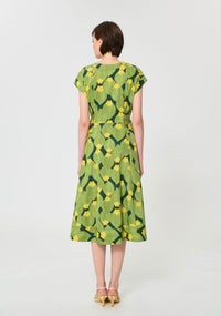 Button Down SF green and yellow botanical print midi dress with V-neck, short sleeves, and self-tie waist. 100% cotton.