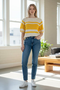 Button Down SF lemon and white striped cotton short sleeve sweater on a woman wearing blue jeans.