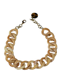 Button Down SF marbled beige and cream resin link necklace with gold chain detail and tortoise shell charm.