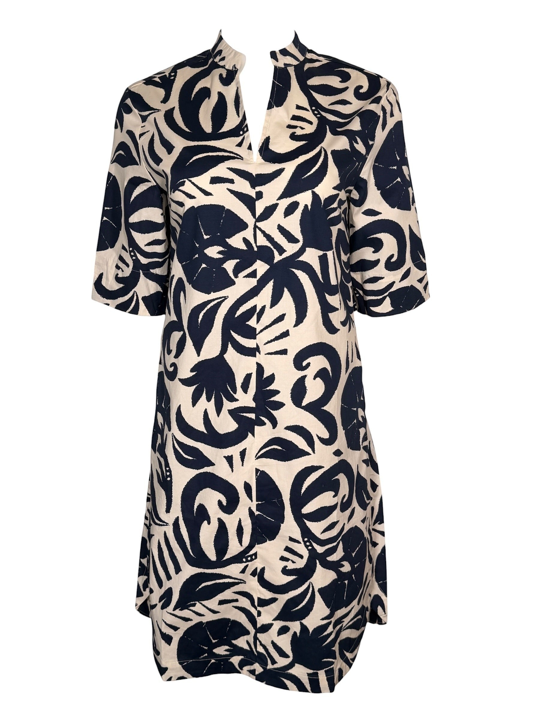 Button Down SF navy and white abstract floral print 100% cotton dress with stand collar and V-neckline.