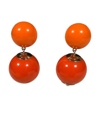 Button Down SF orange resin double ball drop earrings with gold-tone accents. Made in Paris.