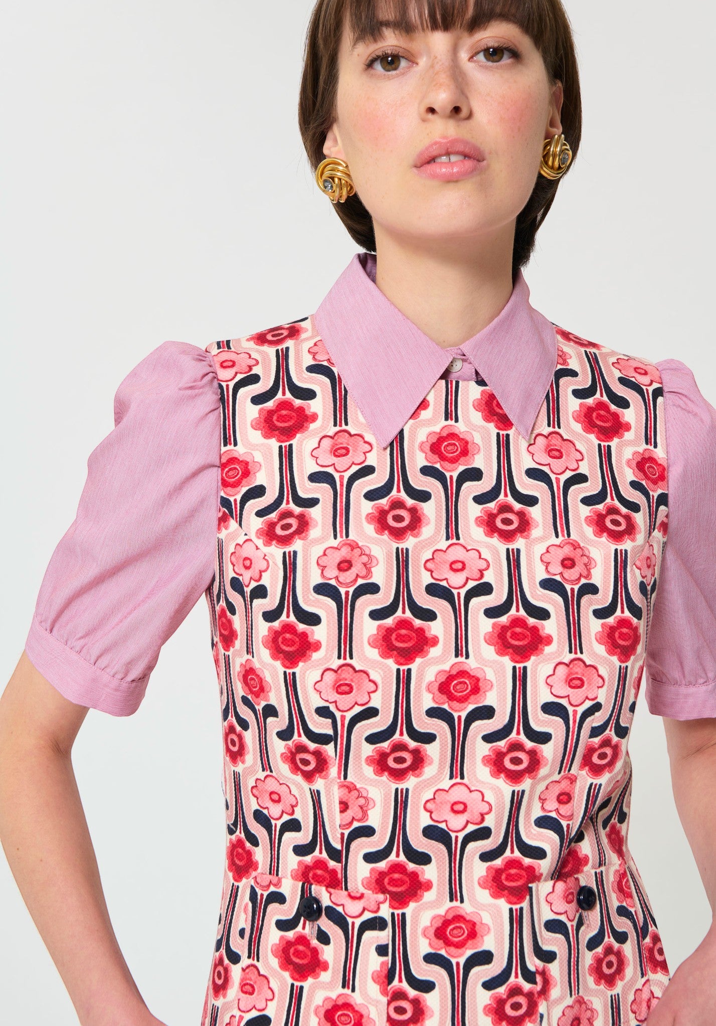 Button Down SF pink, red, navy floral print cotton mini dress with puff sleeves and collar.