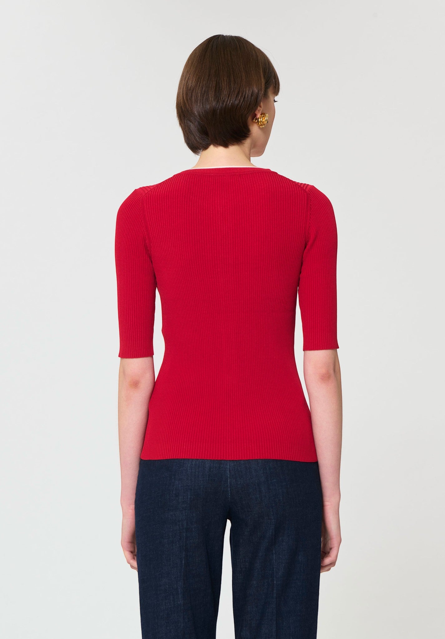 Button Down SF red ribbed knit short-sleeve cardigan with button front and white trim. Viscose blend.