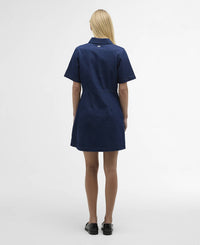 Button Down SF rinse wash blue denim mini shirt dress with short sleeves and side pockets, worn by a blonde model.