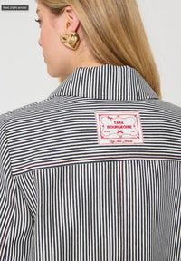 Button Down SF TARA JARMON ecru stripe cotton duffle jacket with toggle closure and classic collar.
