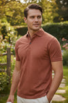 BUTTON DOWN MEN'S TECH POLO - HEATHER BURNT ORANGE